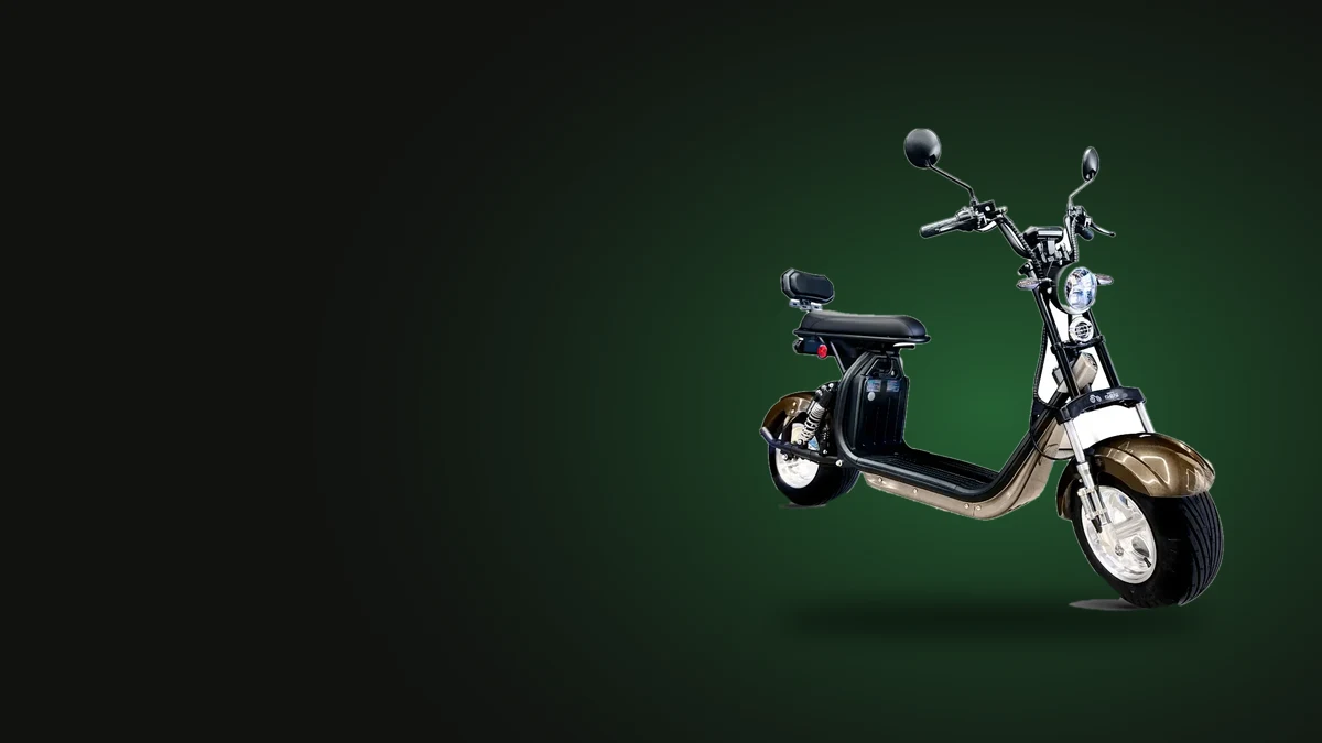 Scooter elétrica 3000W Motomaster X11 em fundo escuro, vista de três quartos, com farol redondo e pneus largos